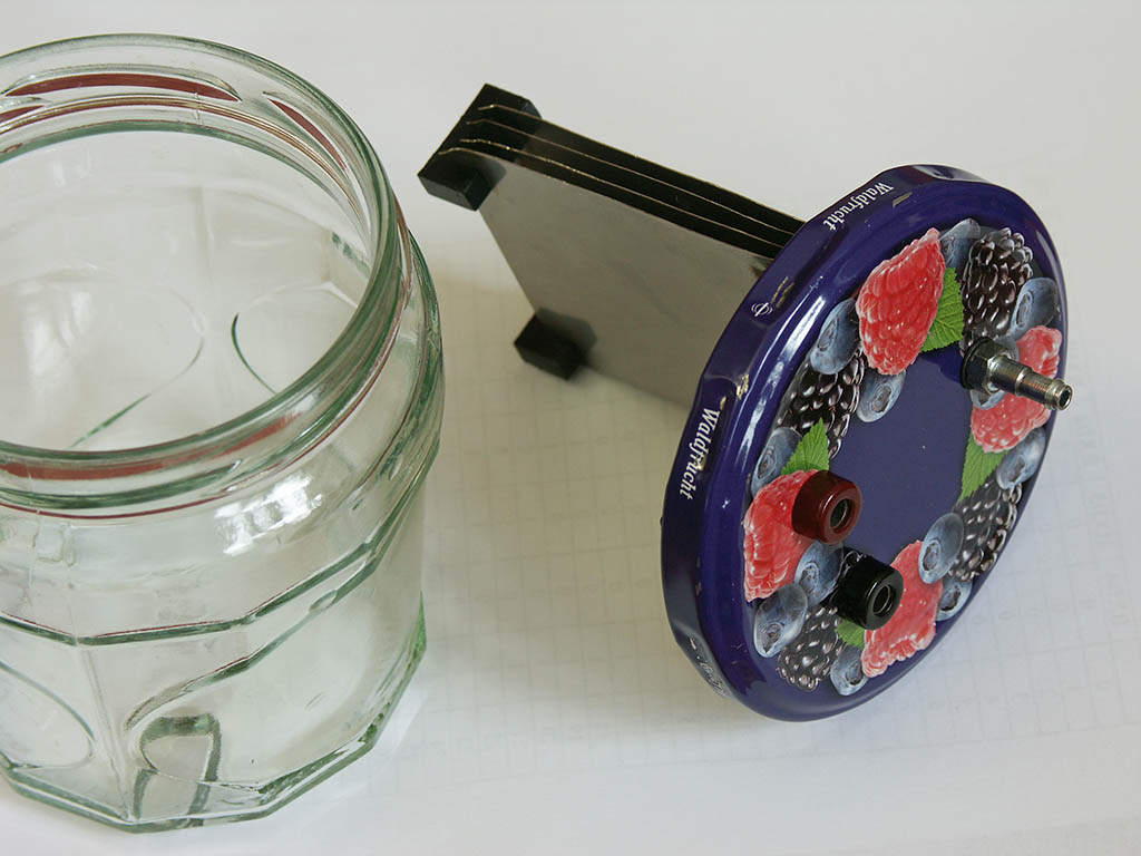 Quick and dirty oxyhydrogen generator - Using 0.3 mm stainless steel sheets, some plastic spacers and a jam jar as an enclosure with electrical input ...