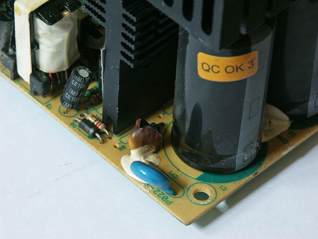 A broken Tagan 480W power supply. Got this on ebay. Seems to have been hit by lightning, the 2 main capacitors have zero capacity and some other part ...