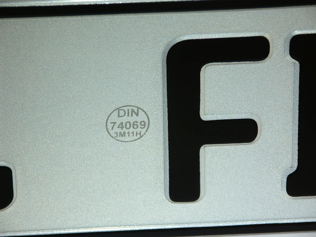 DIN marking on a German license plate - appears only when viewed at a certain angle